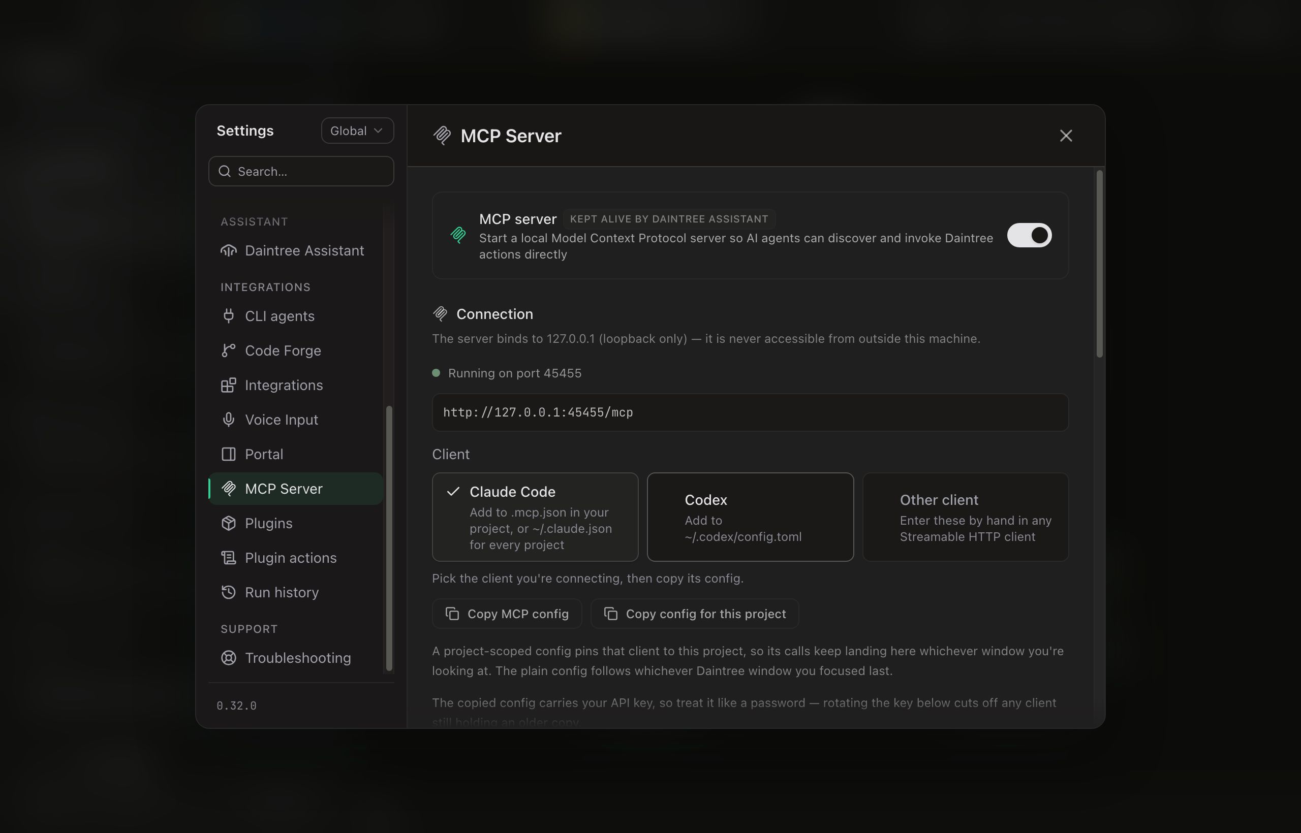 Settings on the MCP Server tab with the server switched on, its header badged KEPT ALIVE BY DAINTREE ASSISTANT. A Connection section notes that the server binds to 127.0.0.1 (loopback only) and is never accessible from outside this machine, shows a green Running on port 45455 line, and gives the endpoint http://127.0.0.1:45455/mcp. Below it a Client picker offers Claude Code (selected), Codex and Other client, above Copy MCP config and Copy config for this project buttons.