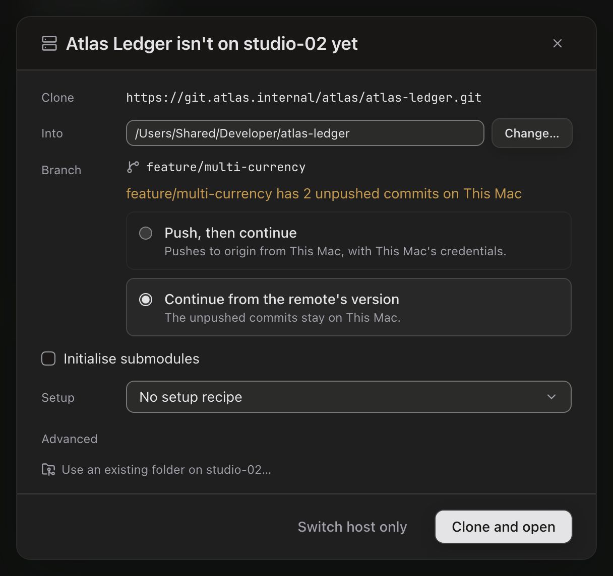The dialog titled Atlas Ledger isn't on studio-02 yet. Clone: https://git.atlas.internal/atlas/atlas-ledger.git. Into: /Users/Shared/Developer/atlas-ledger, with a Change… button. The same Branch row, with Continue from the remote's version selected. An unchecked Initialise submodules checkbox, Setup set to No setup recipe, an Advanced toggle, and a Use an existing folder on studio-02… link. Buttons: Switch host only and Clone and open.