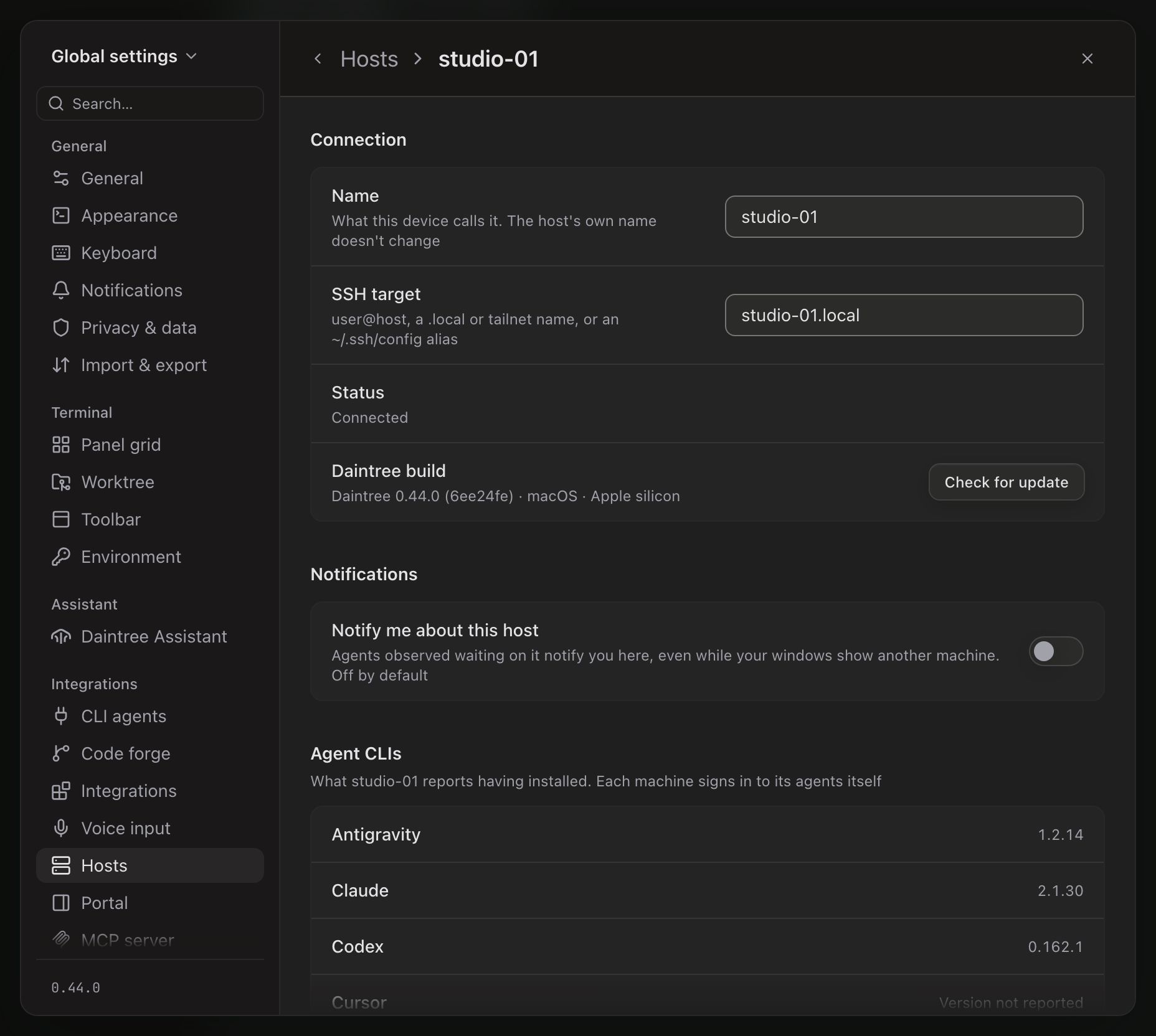 The details page for a host, headed Hosts › studio-01. Connection: Name studio-01, SSH target studio-01.local, Status Connected, and Daintree build Daintree 0.44.0 (6ee24fe) · macOS · Apple silicon, with a Check for update button. Notifications: Notify me about this host, switched off. Agent CLIs: What studio-01 reports having installed, listing Antigravity 1.2.14, Claude 2.1.30, Codex 0.162.1 and, cut off at the bottom, Cursor.